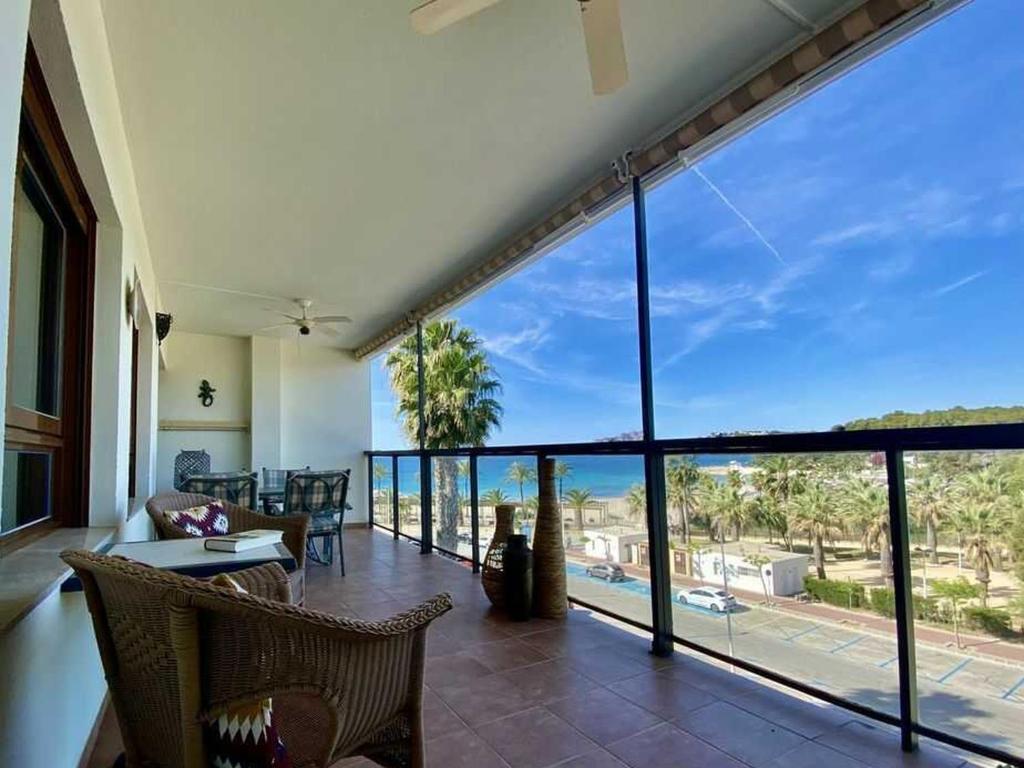 a living room with a view of the ocean at Luxurious apartment seafront Moraira by Moraira Holiday Homes in Moraira