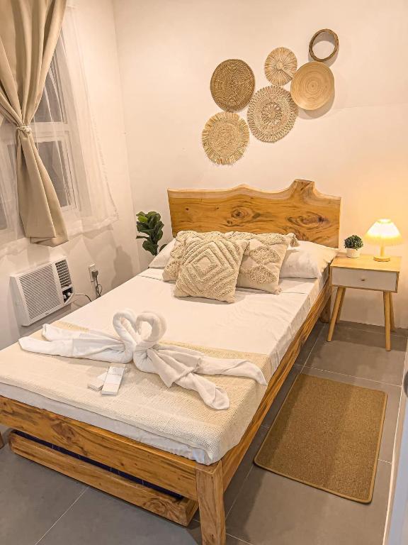 a bedroom with a bed with a bow on it at South Haven in Calo