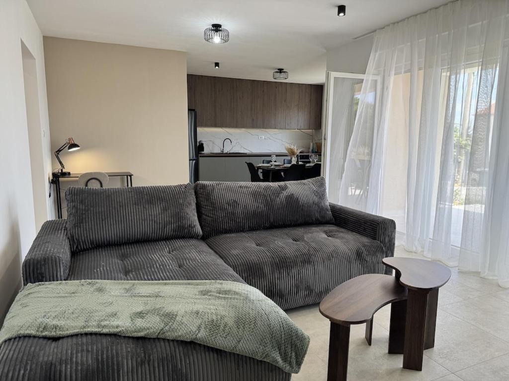 a living room with a couch and a table at Apartment Terra Verde in Kastel Stari
