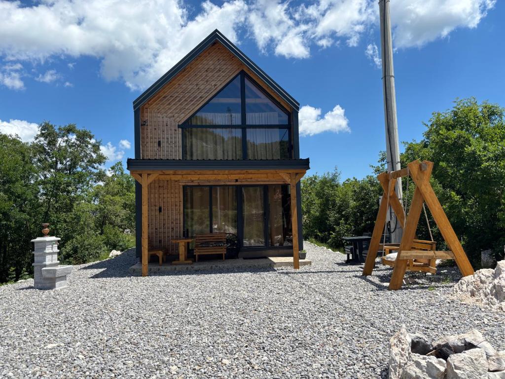 a tiny house on top of a pile of gravel at Driftwood Dreams in Cetinje