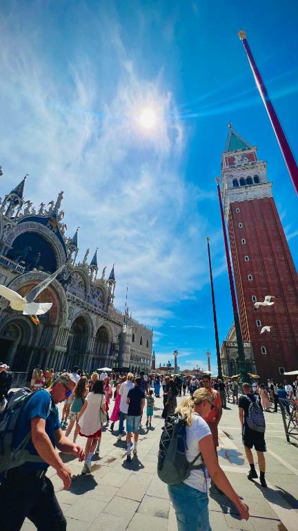 a group of people walking in front of a building at CASA BANON in Venice