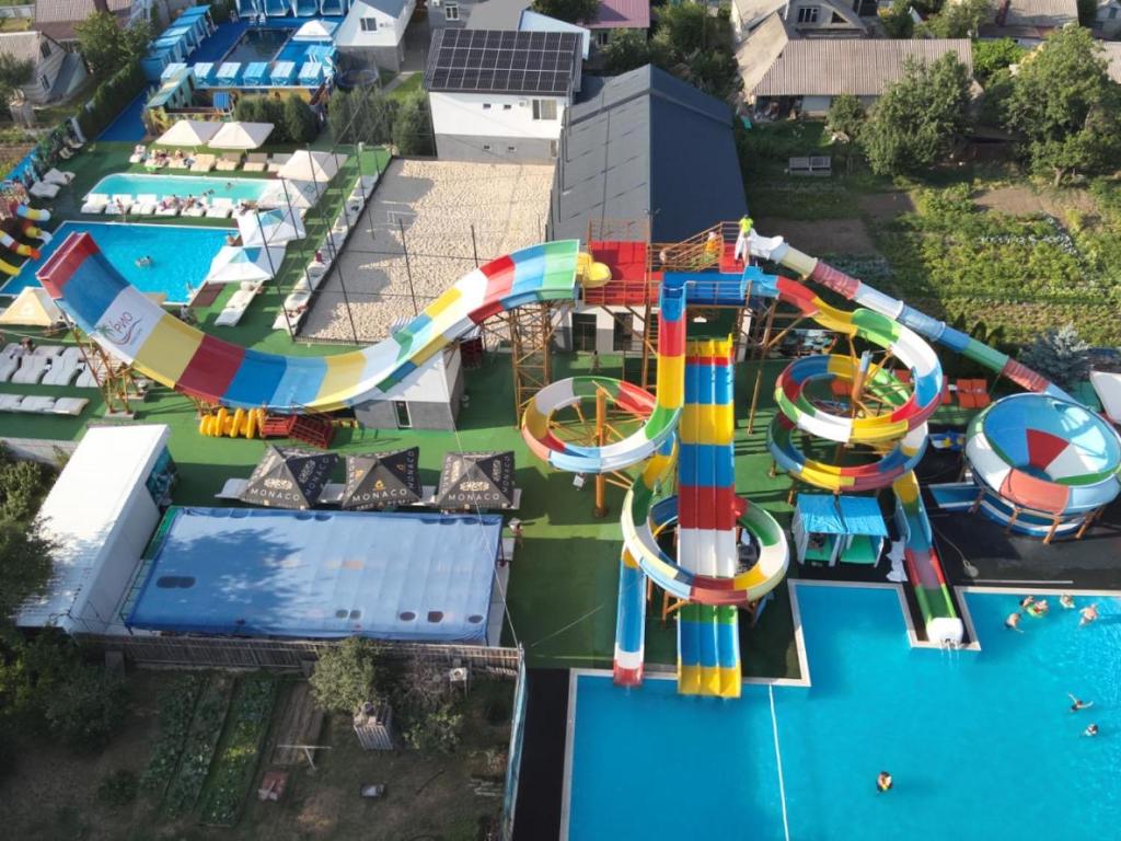 an aerial view of a water park with a roller coaster at Hotel Lux Aquapark in Poltava