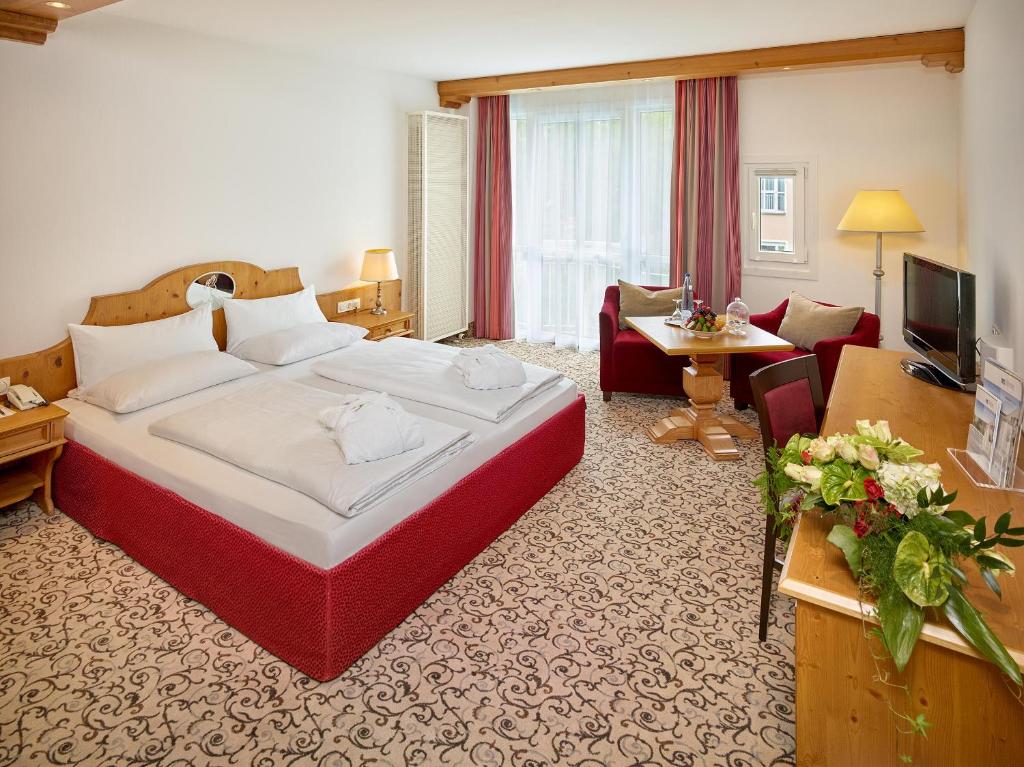 Postel nebo postele na pokoji v ubytování Hotel Maximilian