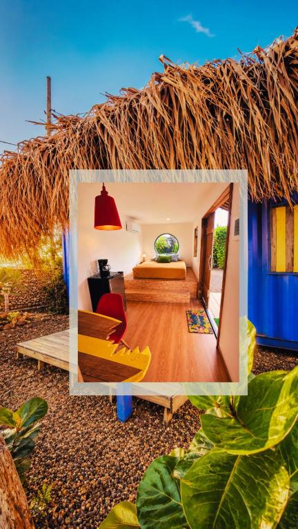 a room with a bed and a thatch roof at Mojarra Beach-Wind Room- Santa Veronica in Salina de Rey