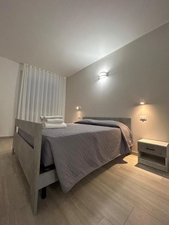 a bedroom with a large bed in a room at Foresteria Lombarda Pavia in Pavia