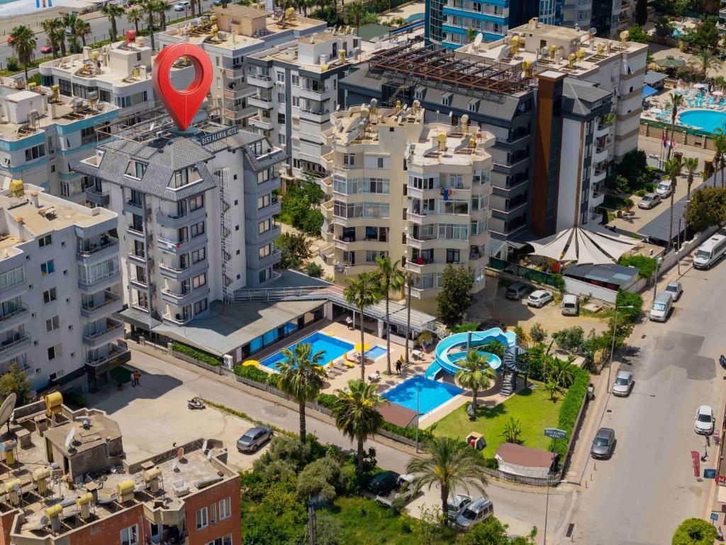 an aerial view of a city with buildings and a pool at Best Alanya Hotel in Alanya