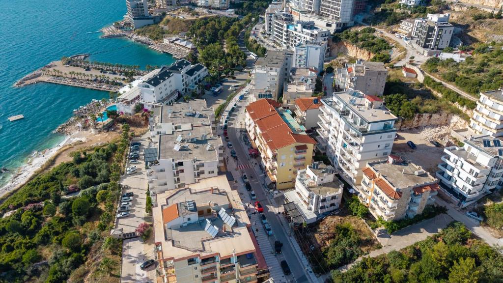 an aerial view of a city next to the ocean at Hotel Primavera in Sarandë