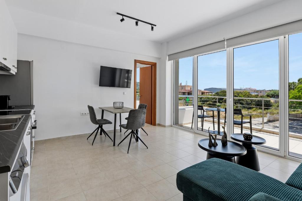 a living room with a couch and a table at Celestial Luxury Residences in Ixia