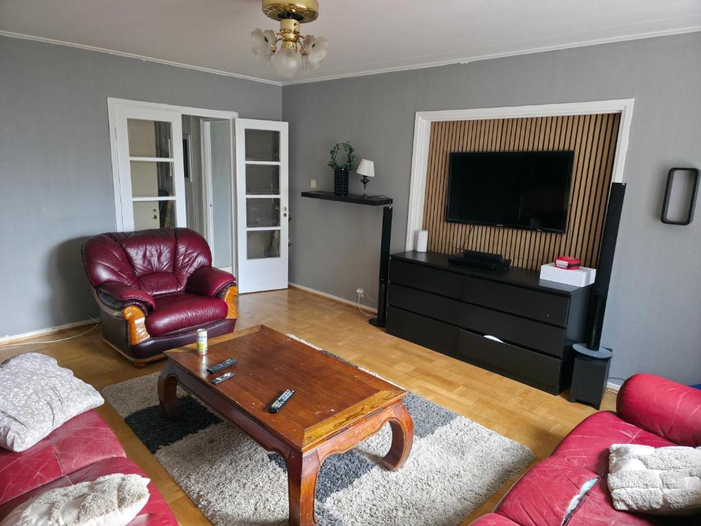 a living room with a couch and a coffee table at Seaside Koster house in Strömstad