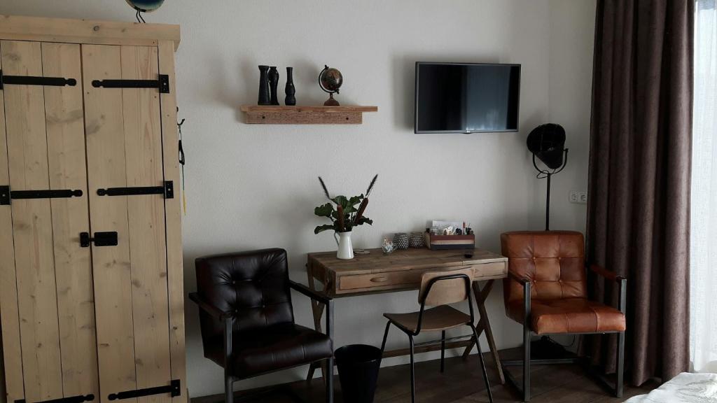 TV a/nebo společenská místnost v ubytování B&B Johannesberg