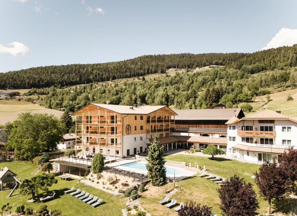 an aerial view of a resort with a swimming pool at Hotel Nussbaumerhof *** in Rodengo