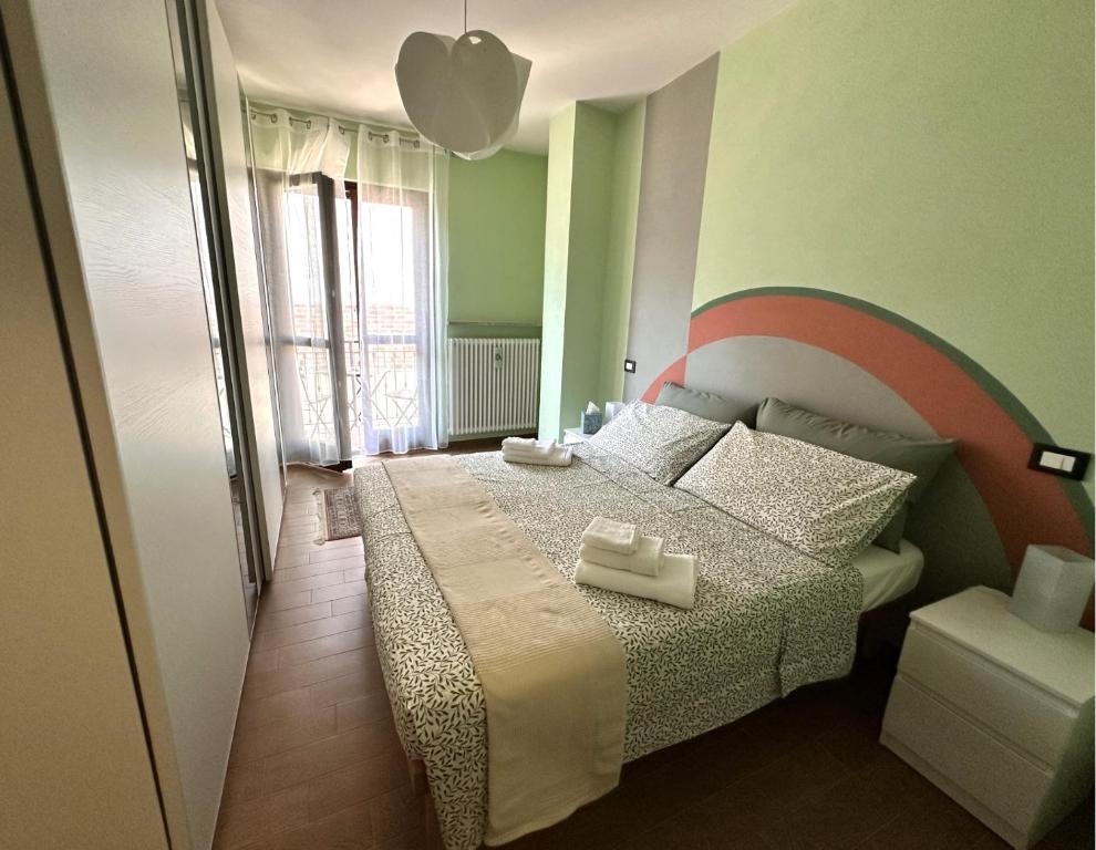 a bedroom with a bed with two towels on it at Maison Josephine in Chiusa di Pesio