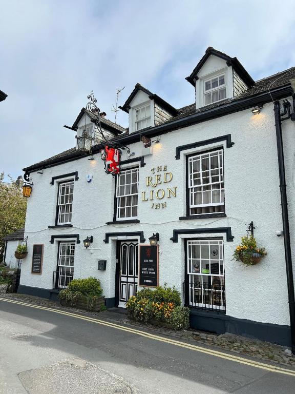 a red lion inn on the corner of a street at Red Lion Inn in Hawkshead