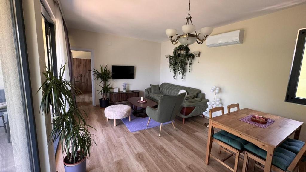 a living room with a couch and a table at Polaris Astra Bay in Lepetani