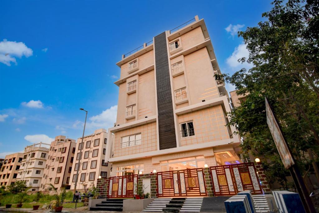 a tall building with a fence in front of it at Hotel Aarnika Villa in New Town