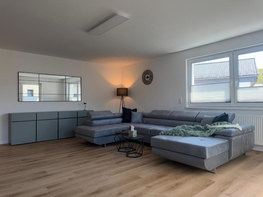 a living room with a couch and a table at APARTMENT in Hambach in Hambach