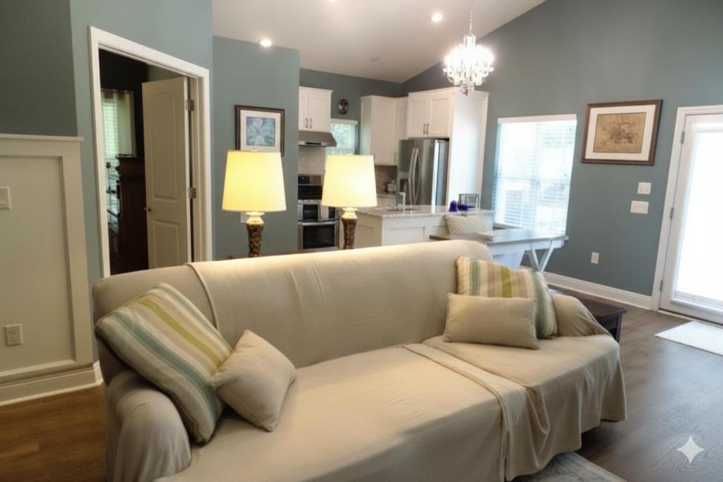 a living room with a couch with pillows on it at The Lantern in Pensacola