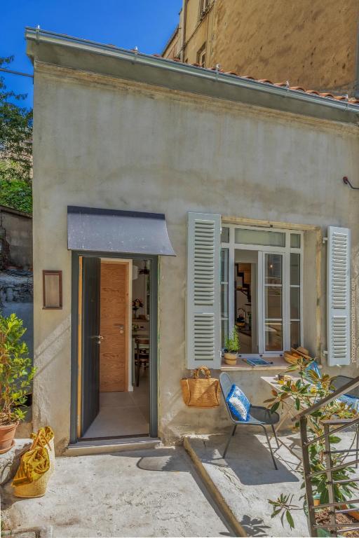a patio with a chair and a building at Casa Campinchi in Bastia