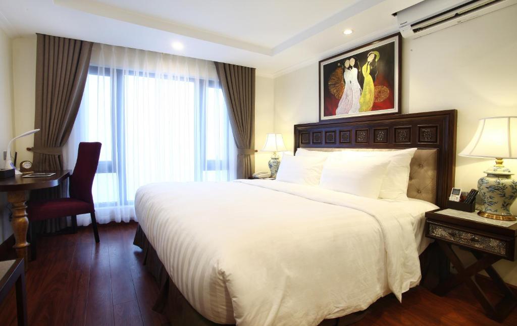 Giường trong phòng chung tại Paris Boutique Hotel Sapa