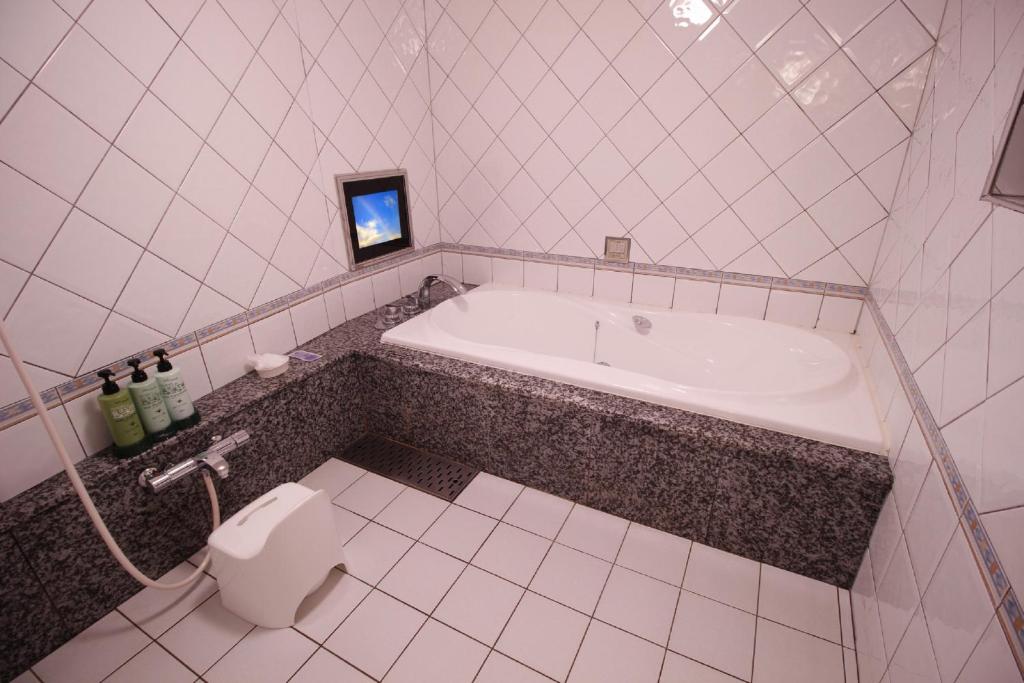 Koupelna v ubytování HOTEL ATLAS Shinkabukicho (Adult Only)