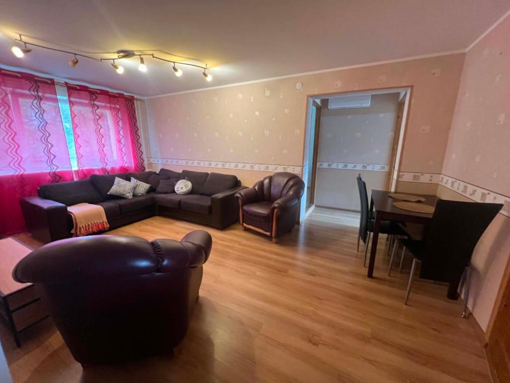 a living room with a couch and a table at Tähe majutus in Mustvee