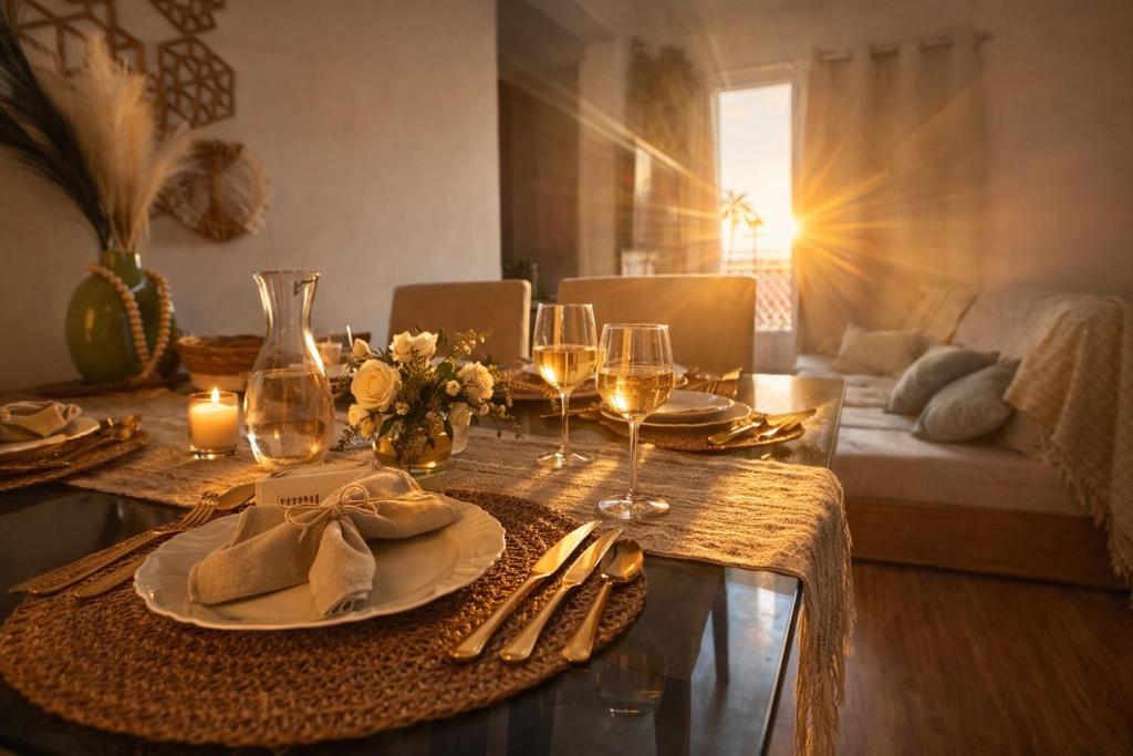 a dining table with wine glasses and napkins on it at Spazio Dela vita in Sorocaba
