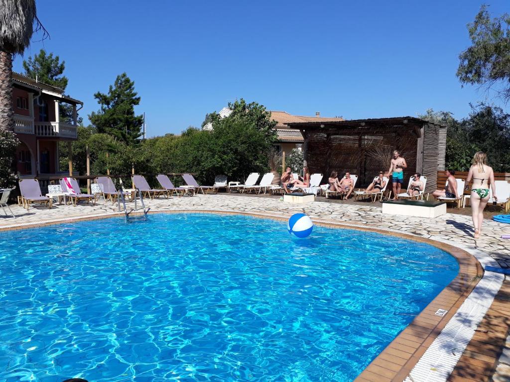 a swimming pool with a ball in the water at 2BR Apt Balconies Pool 3 in Gouvia