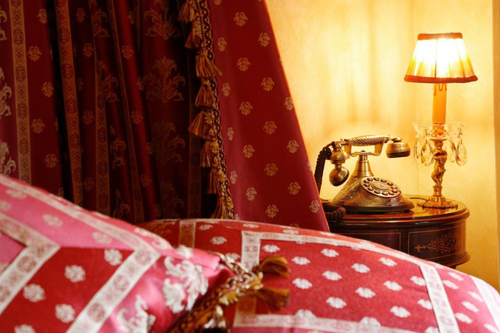 Posteľ alebo postele v izbe v ubytovaní Hotel Boutique Real Casona De Las Amas