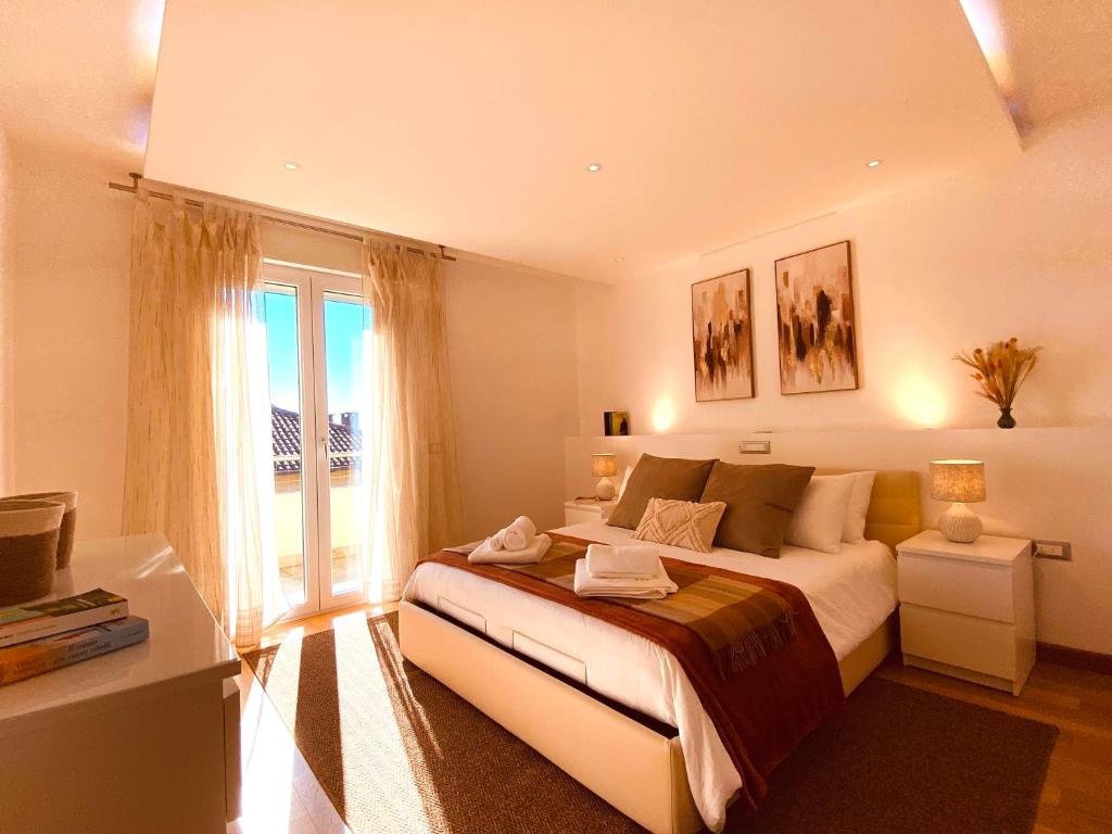 a bedroom with a large bed and a window at Anna's Cozy Nest a Udine in Udine