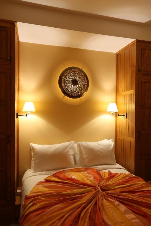 Postel nebo postele na pokoji v ubytování Riad Enchanté