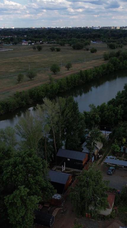 an aerial view of a river next to a building at The Doma in Oral