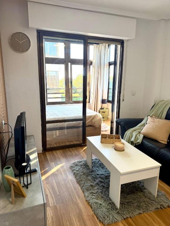 a living room with a couch and a table at Cute get away apartment RBLD in La Mata
