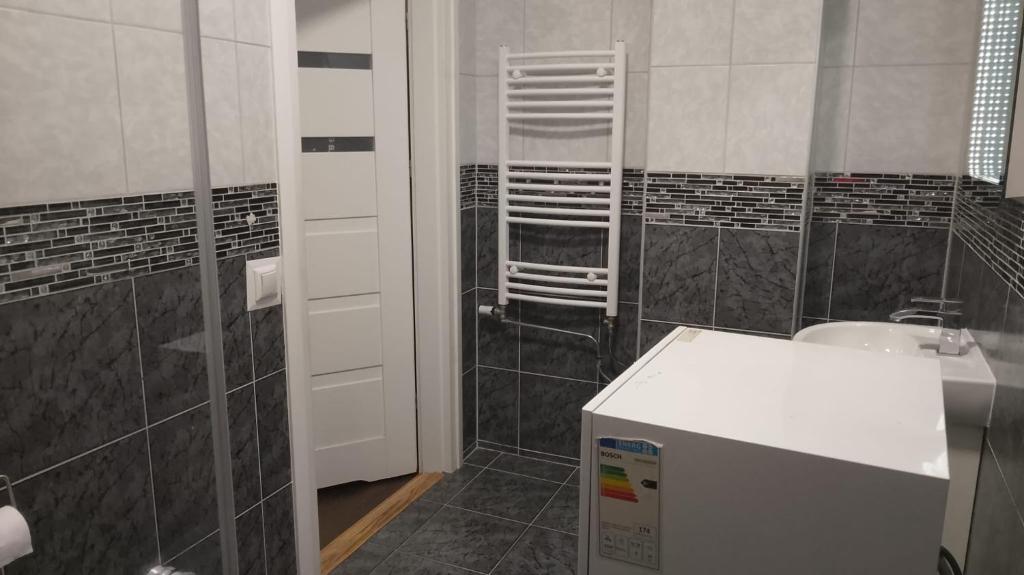 a bathroom with a sink and a toilet in it at Studio Sleeps 1 in Sundbyberg in Sundbyberg