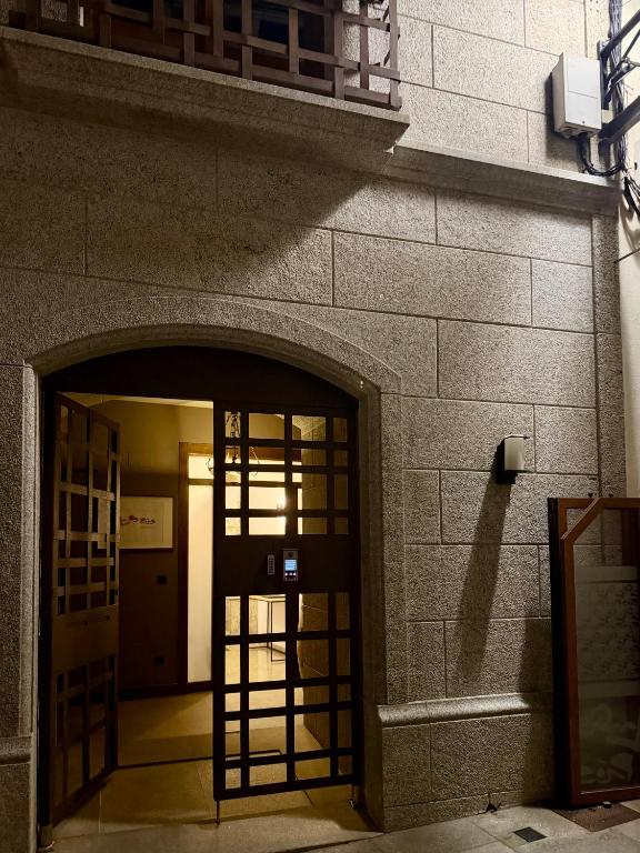 an entrance to a building with an open door at Laros Pios Alojamiento 4 in Villalba