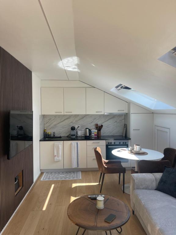 a living room with a couch and a table at Appartement Wonder 2 au centre de Couvet in Couvet