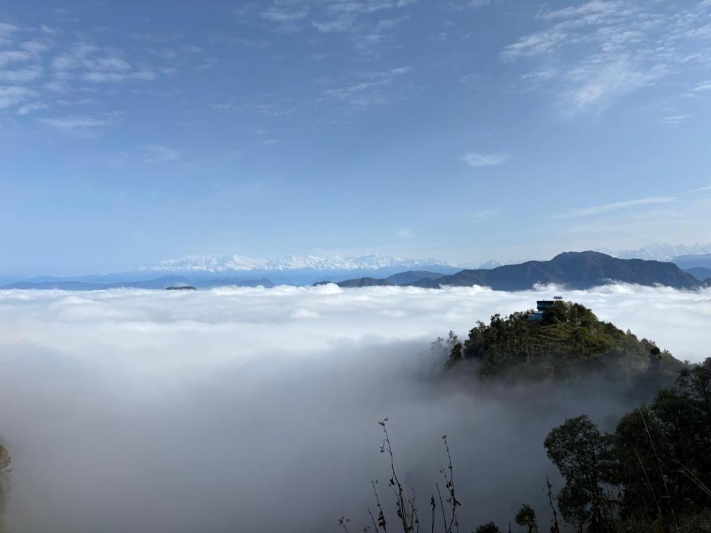 a mountain above a sea of clouds at Gauri Homestay in Pithorāgarh