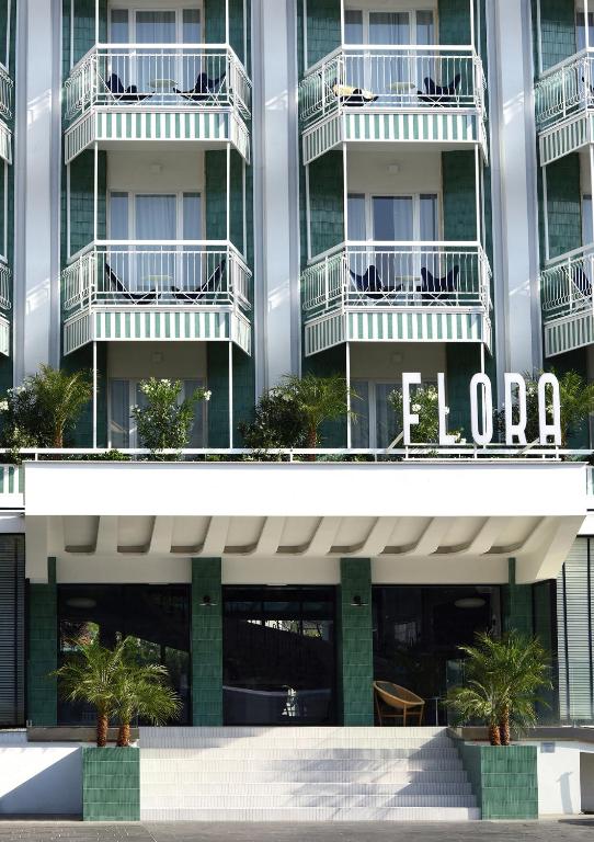 a building with a sign on the side of it at Grand Hotel Flora in Sorrento