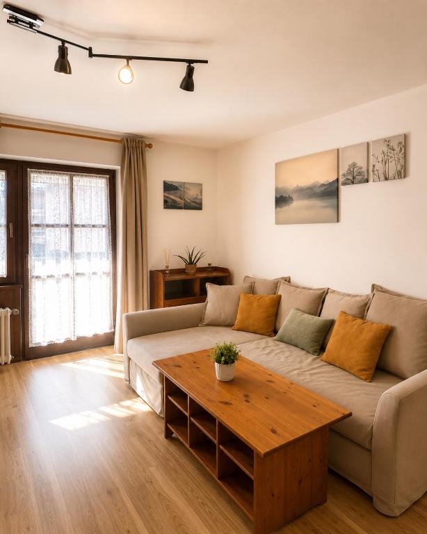 a living room with a couch and a table at Falkenstein Loft 55 in Zwiesel