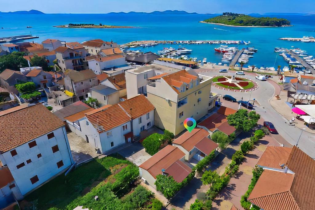 an aerial view of a town with a marina at Lavender Mobile Houses in Pakoštane