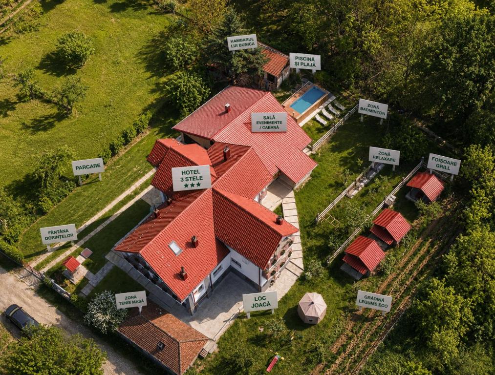an overhead view of a house with red roof at Perla Argesului, hotel romantic elegant cu piscina, sport, petreceri, natura, curte, gradina, priveliste, parcare, cazare Transfăgarasan Curtea de Arges in Albestii de Arges