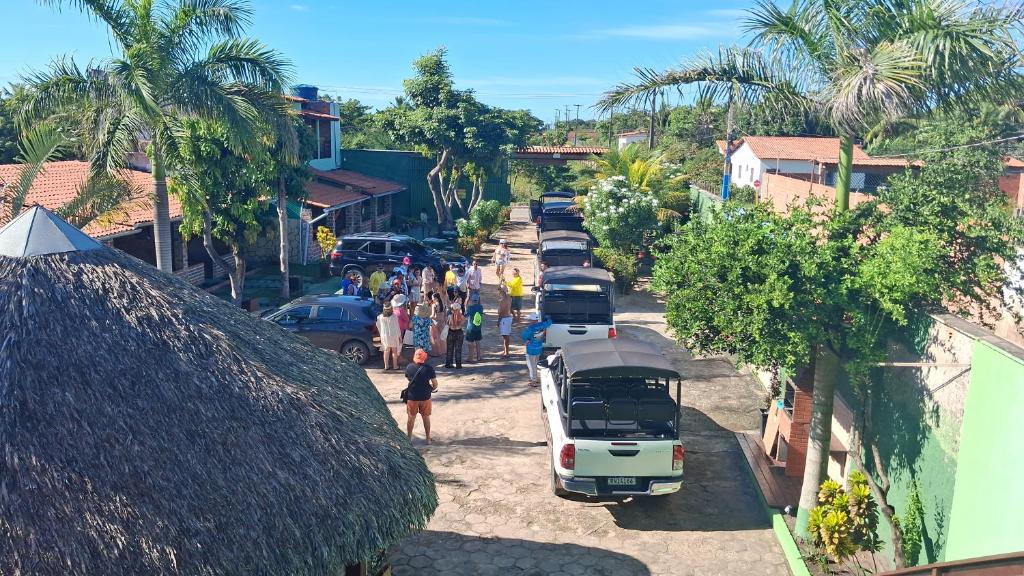 a group of buses parked on the side of a street at Pousada Recanto Sapoti in Barreirinhas