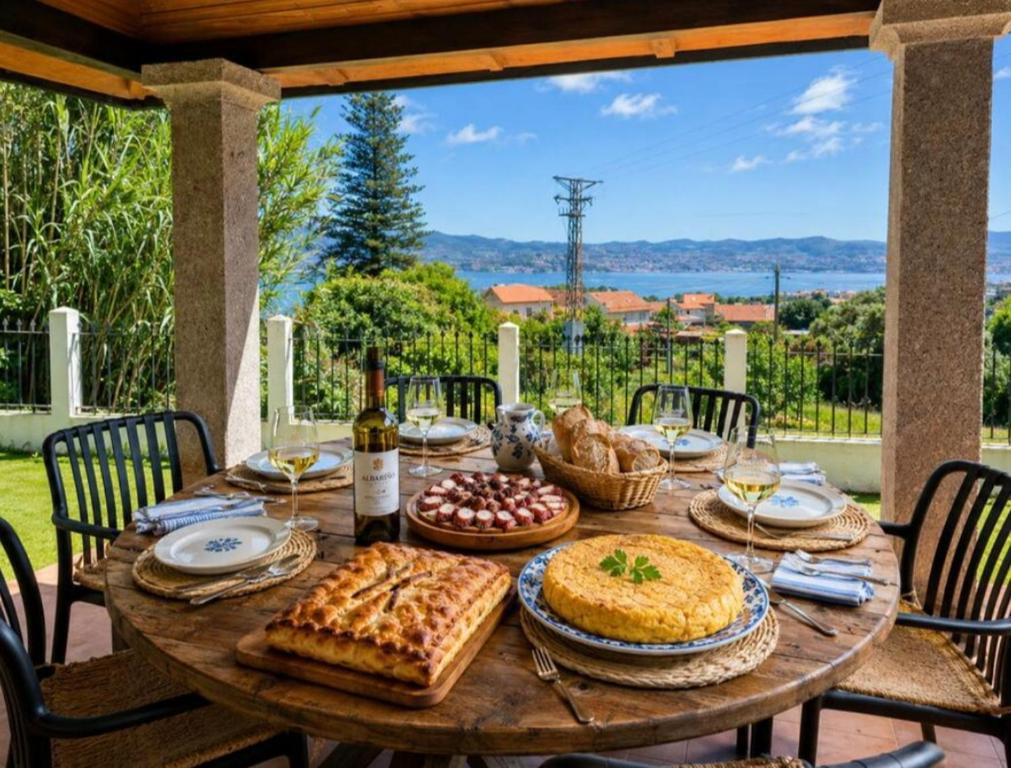 a wooden table with food and wine on a patio at Os piñeiros vacacional in Moaña