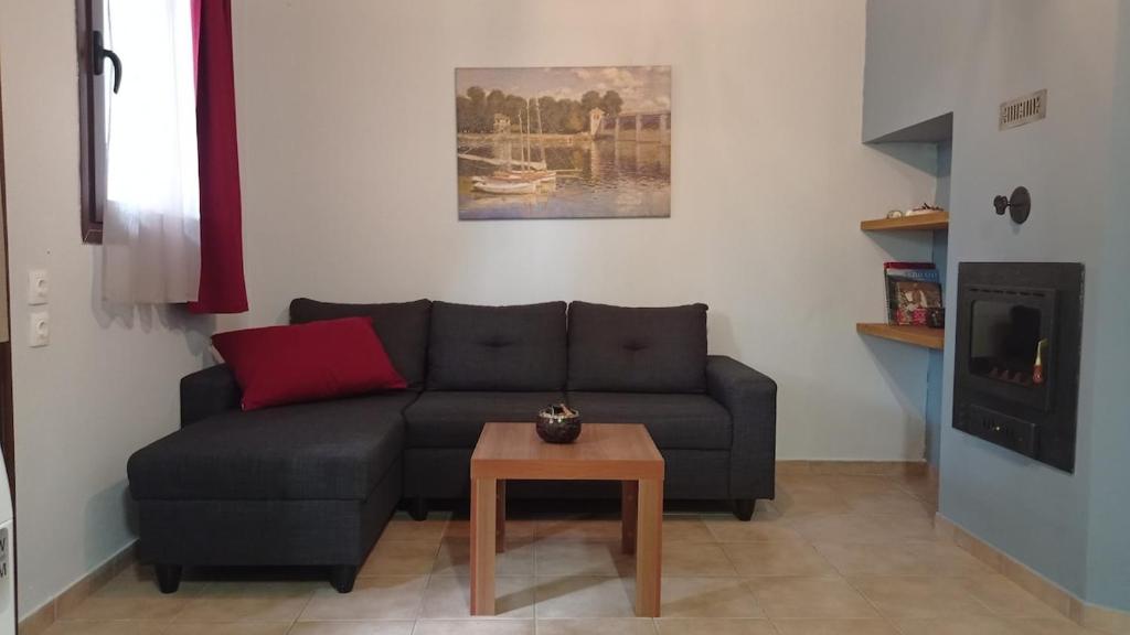 a living room with a couch and a table at House with garden in Agria