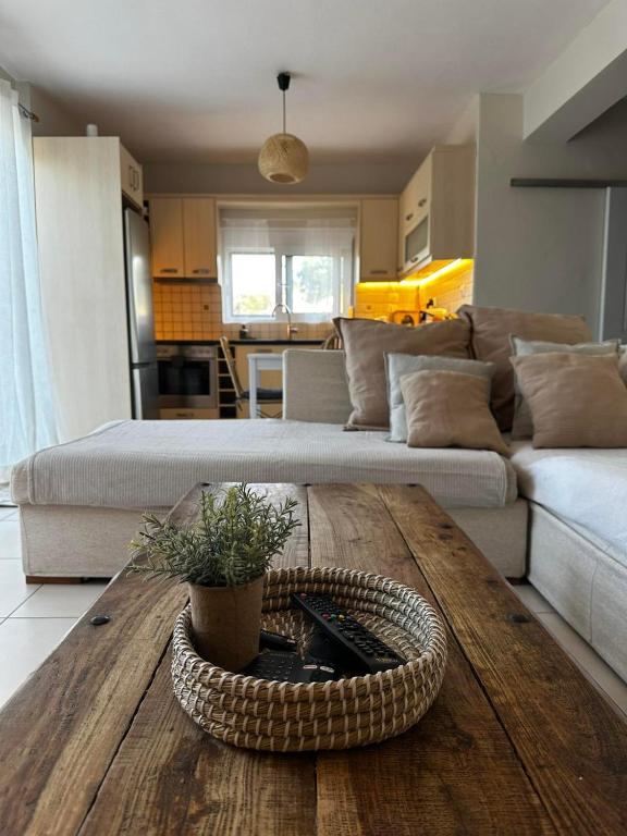 a living room with a coffee table and a couch at Lithos in Khalkoútsion