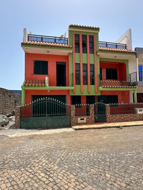a house with a fence in front of it at Recanto da Paz in Tarrafal