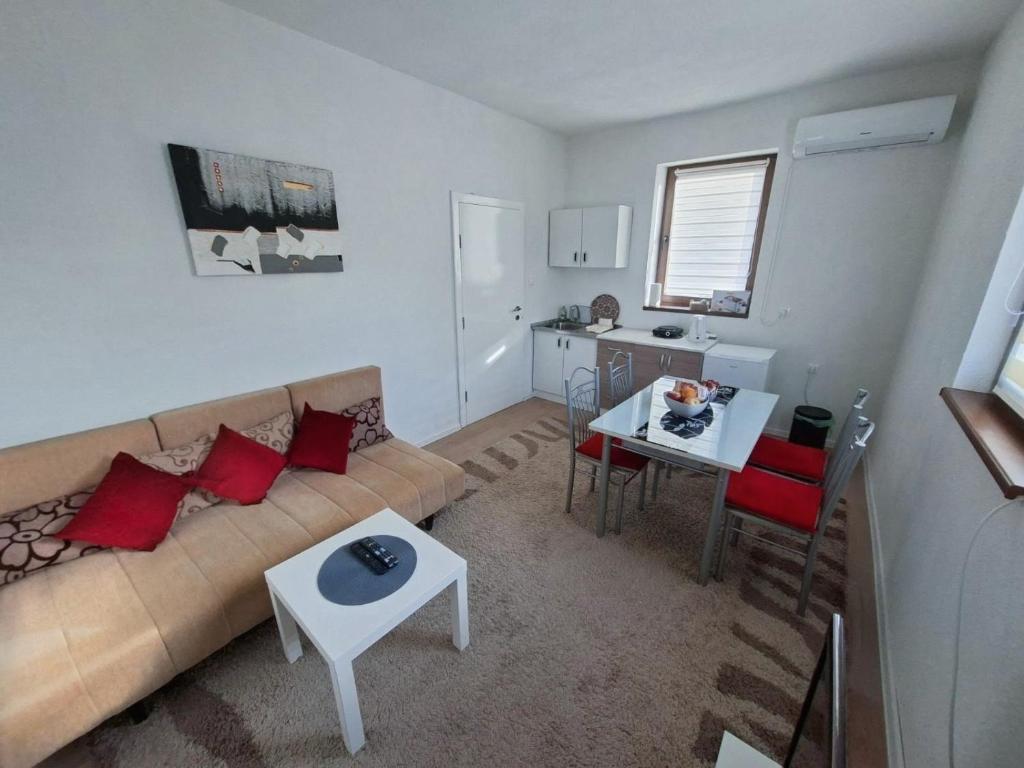 a living room with a couch and a table at Apartment Kraljevac in Visoko