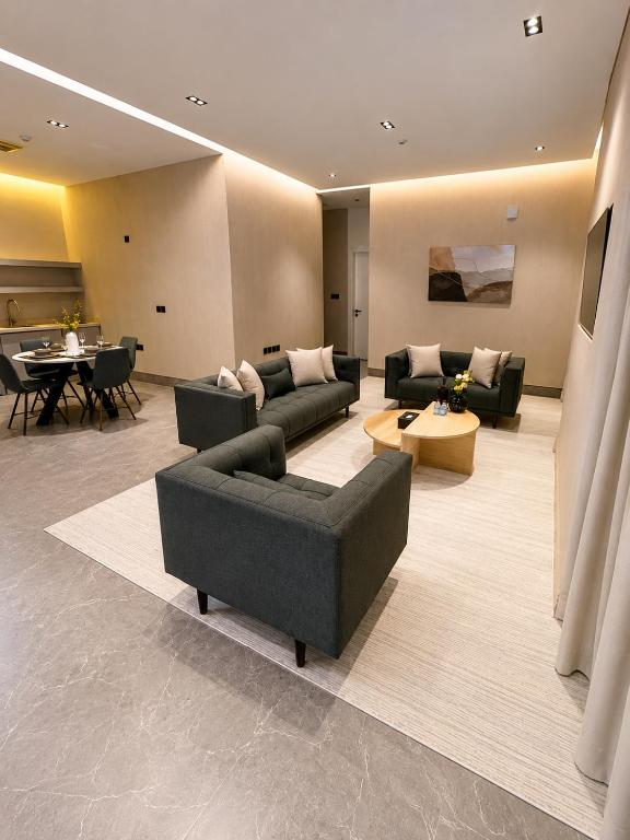a large living room with couches and a table at ملاذ 1 in Riyadh