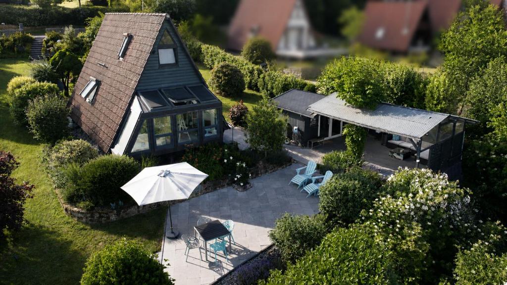 an aerial view of a house with a patio and umbrella at Villa Aurora in Waldbrunn