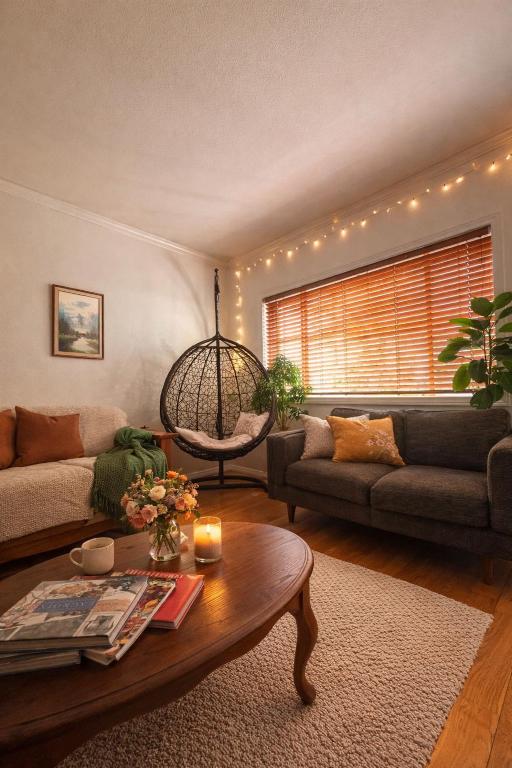 a living room with a couch and a table at The Ardmore Home Share in Los Angeles