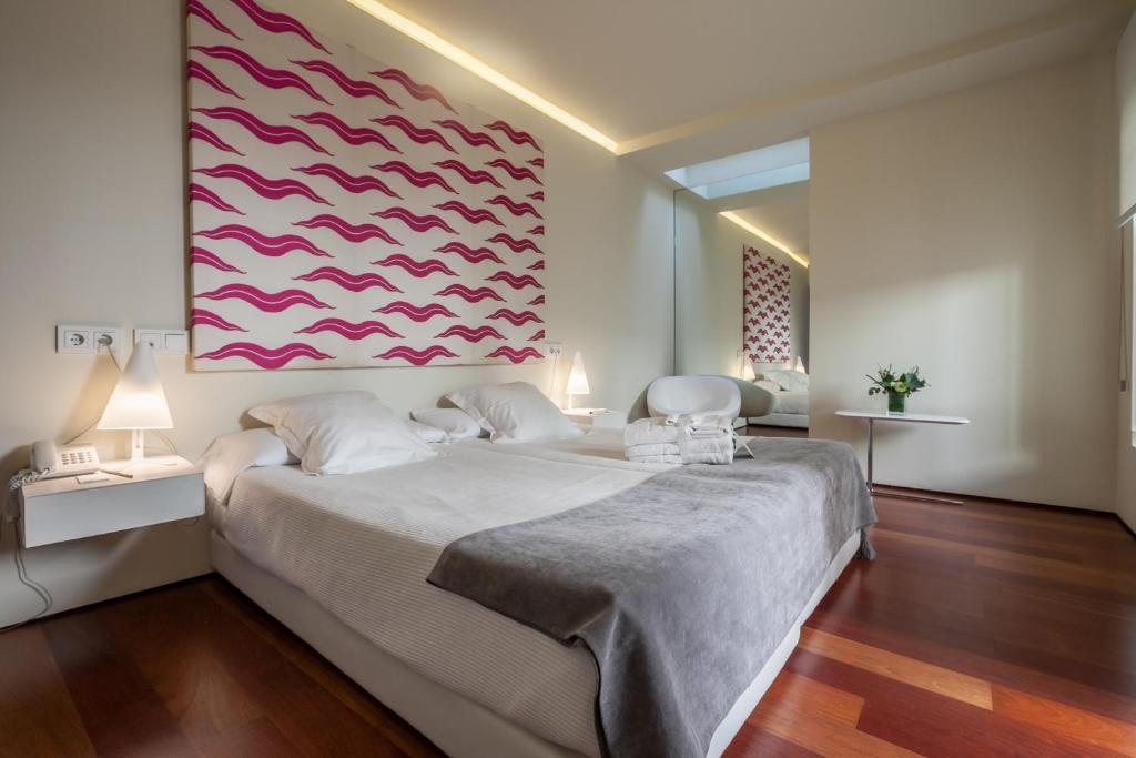 Posteľ alebo postele v izbe v ubytovaní Hotel Viento10